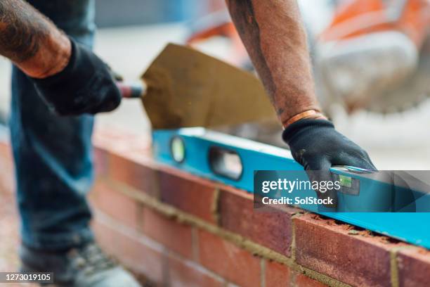 level check - brickie stock pictures, royalty-free photos & images