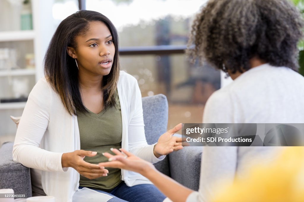 Unrecognizable mother and teen daughter argue
