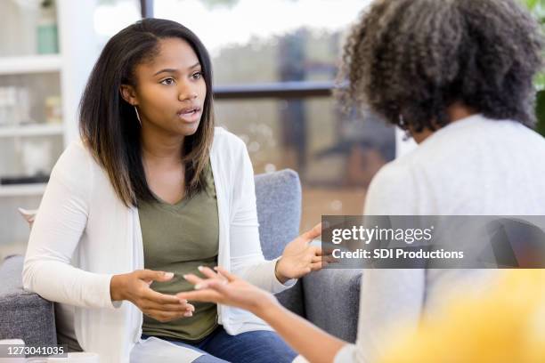 unrecognizable mother and teen daughter argue - frustrated parent stock pictures, royalty-free photos & images