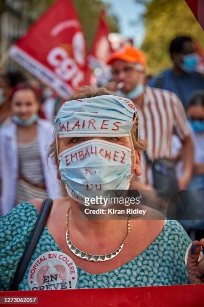 Hospital worker and member of the CGT Union, demonstrates during a day of strikes and protests throughout France, as health workers show their...