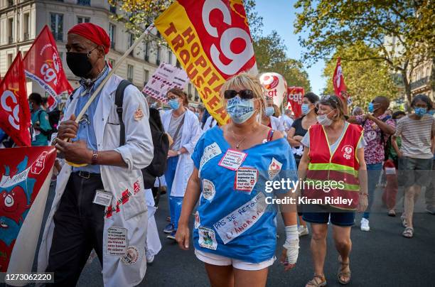 Hospital workers, members of the CGT Union, demonstrate during a day of strikes and protests throughout France, as health workers show their...