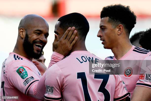 David McGoldrick of Sheffield United celebrates with teammates after scoring his team's first goal during the Carabao Cup second round match between...