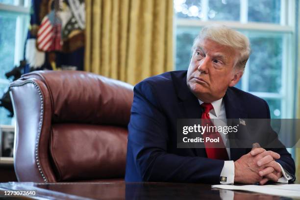 President Donald Trump speaks in the Oval Office during an event commemorating the repatriation of Native American remains and artifacts from Finland...