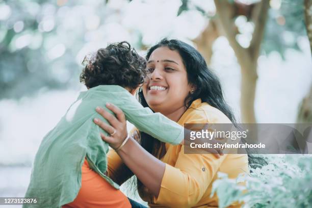 mother and daughter in park - india family stock pictures, royalty-free photos & images