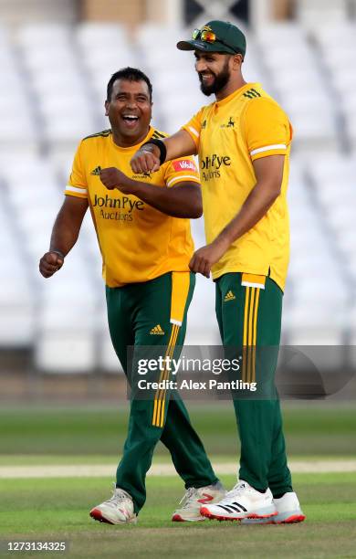 Samit Patel of Notts Outlaws celebrates with teammate Imad Wasim after the wicket of Matt Critchley of Derbyshire Falcons during the T20 Vitality...