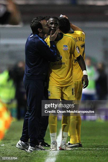 Wilfred Zaha of Crystal Palace gets a kiss from his manager, Dougie Freeman after scoring his teams first goal of the game during the npower...