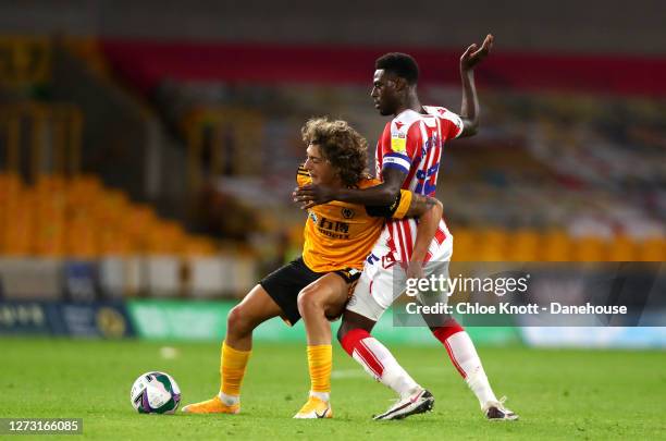 Fabio Silva of Wolverhampton Wanderers and Bruno Martins Indi of Stoke City in action during the Carabao Cup Second Round match between Wolverhampton...
