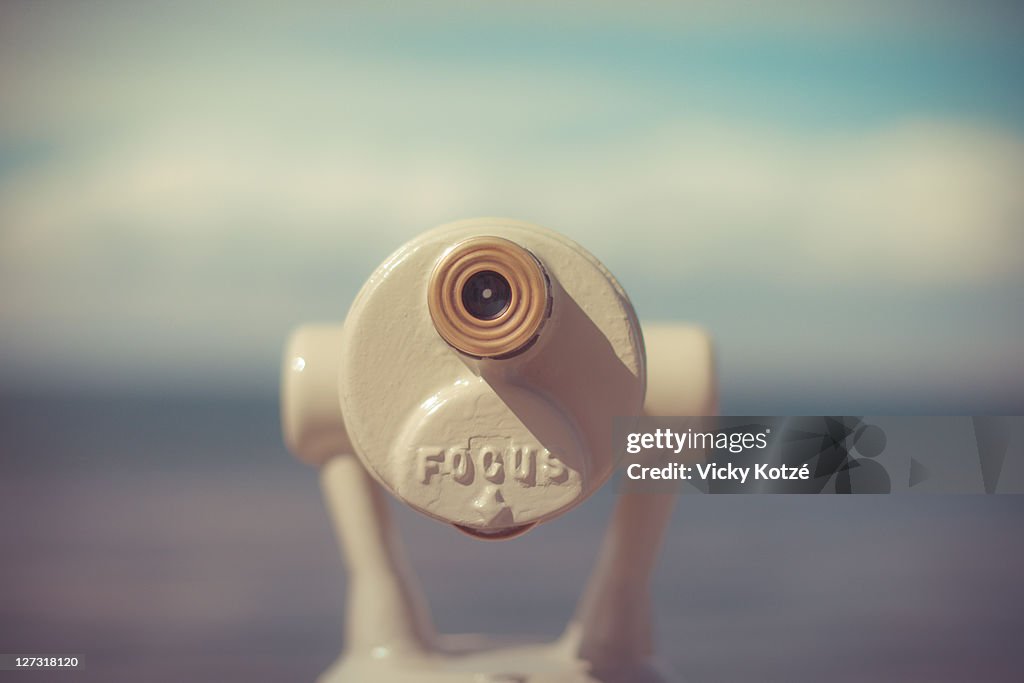 Tourist binoculars looking out to sea