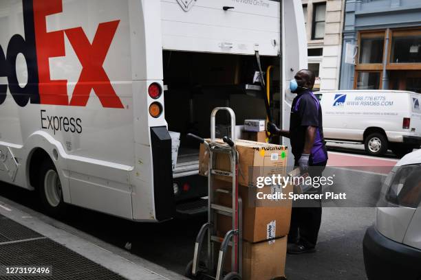 Fedex Rider Fedex Worker Photos and Premium High Res Pictures - Getty Images