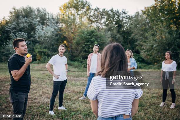 youth people making team training exercise during team building seminar outdoors - throwing stock pictures, royalty-free photos & images