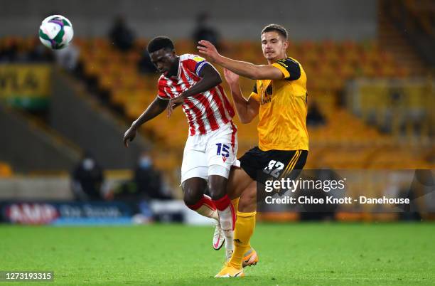 Bruno Martins Indi of Stoke City and Leander Dendoncker of Wolverhampton Wanderers in action during the Carabao Cup Second Round match between...
