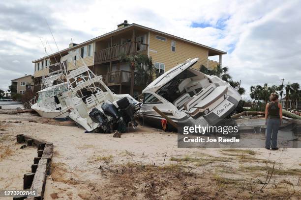 Boats are seen pushed up against a building at Lost Key Marina & Yacht Club after Hurricane Sally passed through the area on September 17, 2020 in...