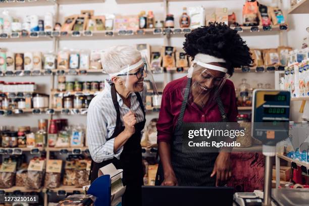 two women planning the business at the grocery store after reopening - business plan covid stock pictures, royalty-free photos & images