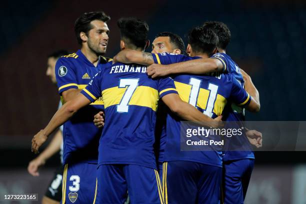 Eduardo Salvio of Boca Juniors celebrates with teammates after scoring the opening goal during a group H match of Copa CONMEBOL Libertadores 2020...