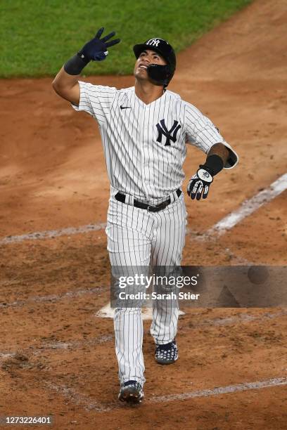 Gleyber Torres of the New York Yankees reacts after hitting a home run during the fourth inning against the Toronto Blue Jays at Yankee Stadium on...