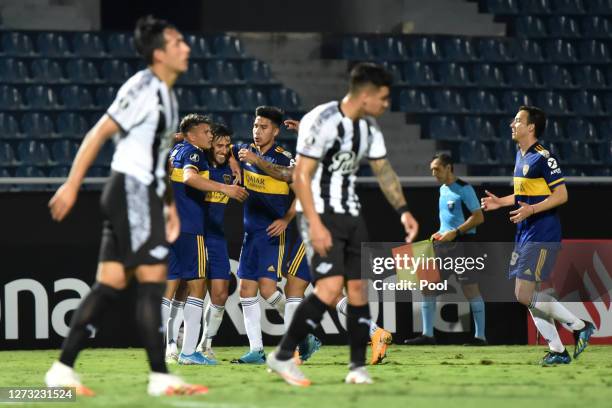 Eduardo Salvio of Boca Juniors celebrates with teammates after scoring the second goal of his team during a group H match of Copa CONMEBOL...