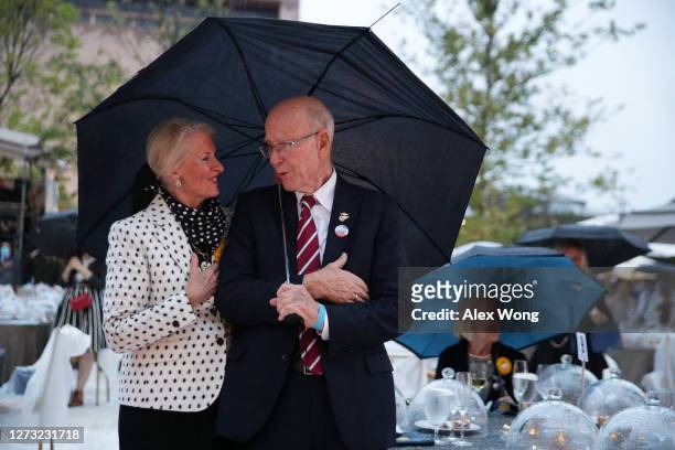 Sen. Pat Roberts , his wife Franki Roberts and other guests listen to the national anthem during a dedication ceremony for The Dwight D. Eisenhower...