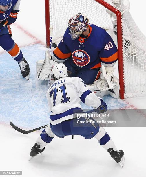 Anthony Cirelli of the Tampa Bay Lightning scores the series winning goal against Semyon Varlamov of the New York Islanders in Game Six of the...