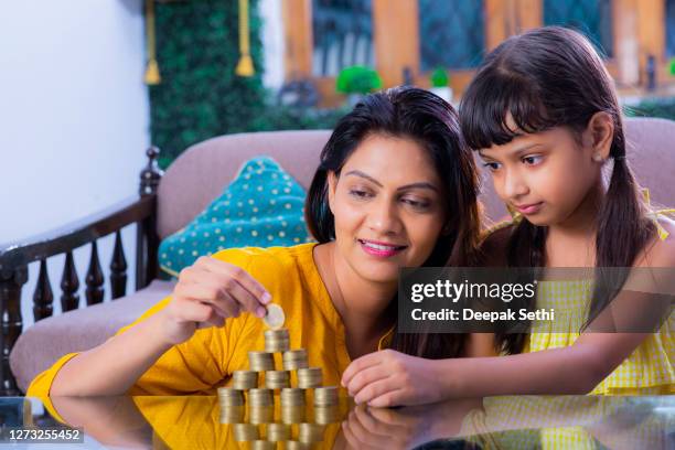 mother and daughter at home - stock photo - children looking graph stock pictures, royalty-free photos & images