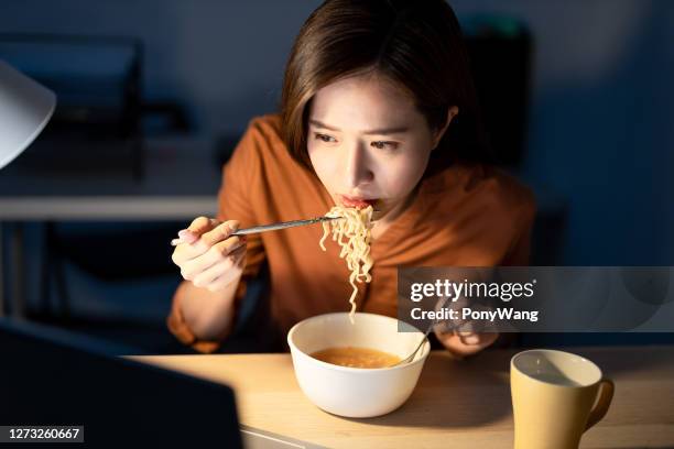 freelance woman work from home - noodles eating stock pictures, royalty-free photos & images