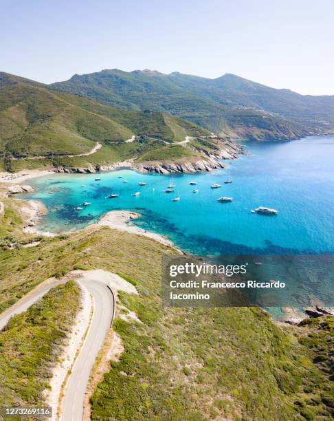 scenic seascape and road near anse d'aliso, corsica, france - corse photos et images de collection