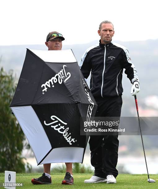 Marcel Siem of Germany stands with caddie Kyle Roadley on second tee during the second round of the Open de Portugal at at Royal Obidos Spa & Golf...