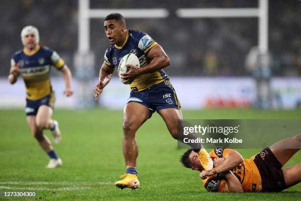 Michael Jennings of the Eels is tackled during the round 19 NRL match between the Parramatta Eels and the Brisbane Broncos at Bankwest Stadium on...