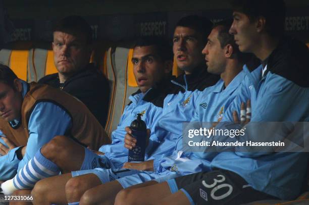 Carlos Tevez of Manchester City looks on from the bench during the UEFA Champions League group A match between FC Bayern Muenchen and Manchester City...