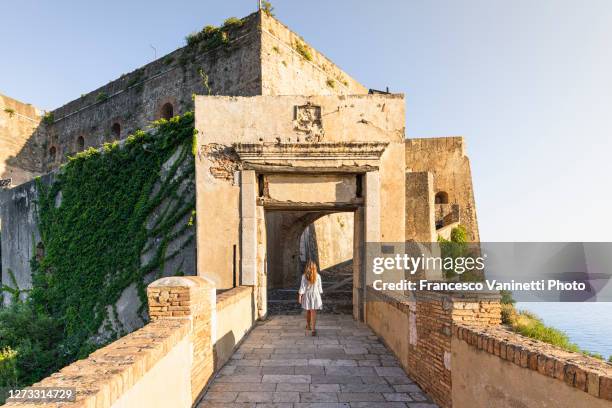 woman visiting the old town of scilla, calabria, italy. - reggio calabria stockfoto's en -beelden