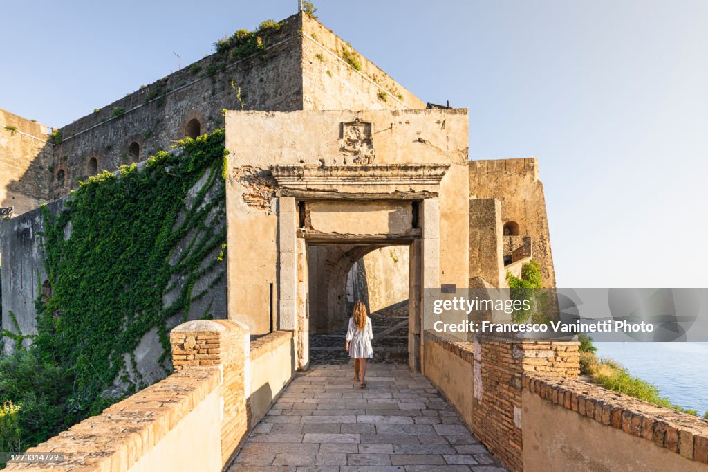 Woman visiting the old town of Scilla, Calabria, Italy.