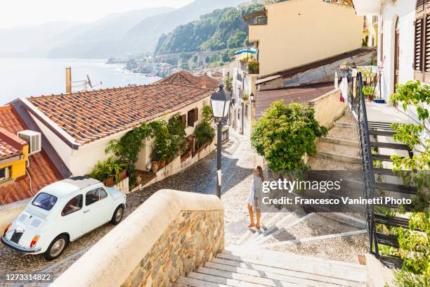 woman visiting the old town of scilla, calabria, italy. - reggio calabria stock-fotos und bilder