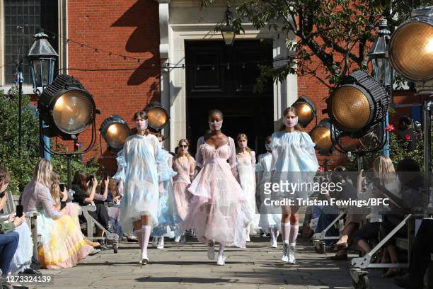 Models walk the runway during the finale at the Bora Aksu show during LFW September 2020 at St Paul's Church on September 18, 2020 in London, England.