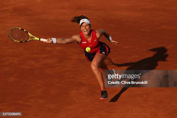 Johanna Konta of Great Britain stretches to play a forehand in her round three match against Garbine Muguruza of Spain during day five of the...