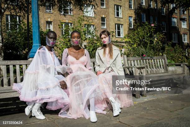Models pose ahead of the Bora Aksu show during LFW September 2020 at St Paul's Church on September 18, 2020 in London, England.