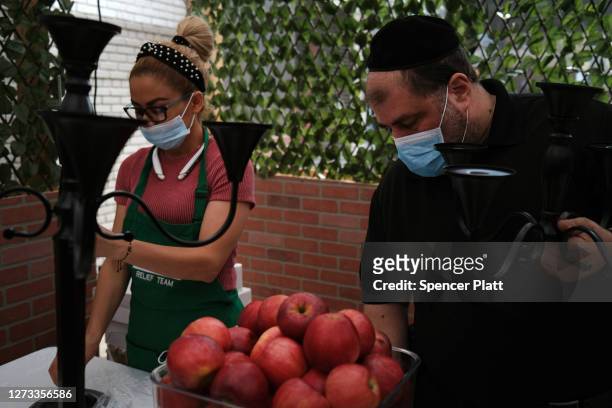 Preparations are made for an evening meal at Masbia, a nonprofit soup kitchen and food pantry in a Hasidic neighborhood in Brooklyn as the community...