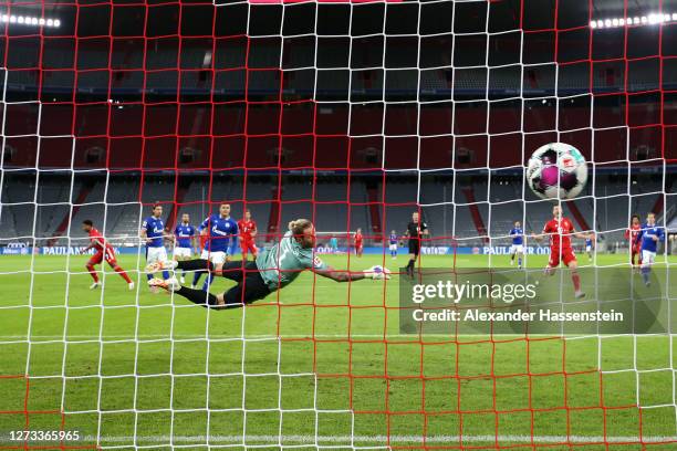 Serge Gnabry of Bayern Munich scores his teams first goal past Goalkeeper, Ralf Fahrmann of Schalke 04 during the Bundesliga match between FC Bayern...