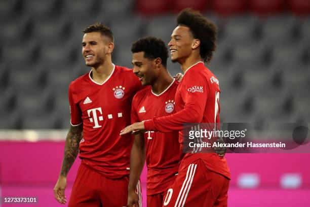 Serge Gnabry of Bayern Munich celebrates scoring his teams fourth goal of the game with team mates Lucas Hernandez and Leroy Sane during the...