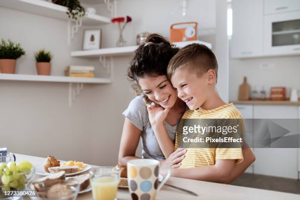 enjoying a family breakfast - mother's day breakfast stock pictures, royalty-free photos & images