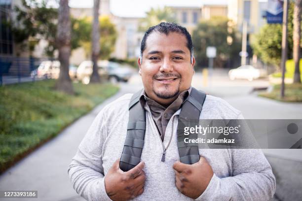 hispanic american veteran college student looking at camera - adult student stock pictures, royalty-free photos & images