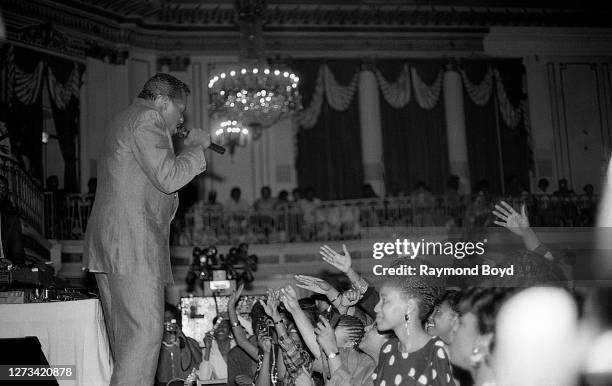 Singer Alexander O'Neal performs during Chicago Bulls basketball player Michael Jordan's birthday celebration at the Palmer House hotel in Chicago,...