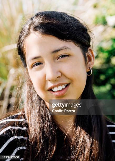 smiling girl in backyard during sunny day - argentina girls stock pictures, royalty-free photos & images