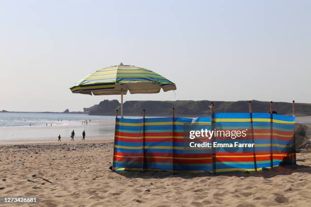 windbreak on beach - beach shelter stockfoto's en -beelden