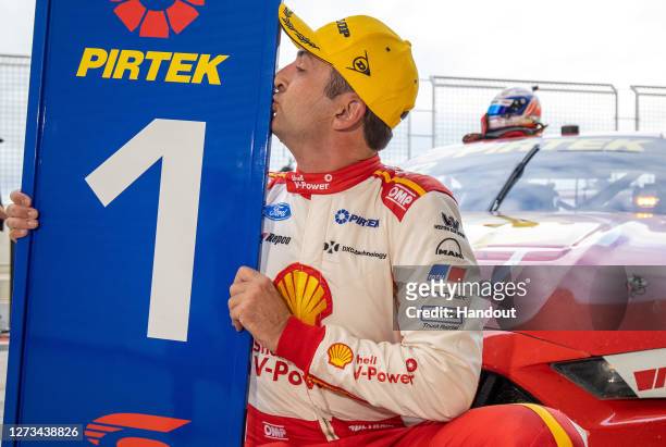 In this handout photo provided by Edge Photographics, Fabian Coulthard driver of the Shell V-Power Racing Team Ford Mustang celebrates after winning...