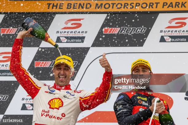 In this handout photo provided by Edge Photographics, Fabian Coulthard driver of the Shell V-Power Racing Team Ford Mustang celebrates after winning...