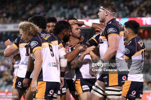 Andy Muirhead of the Brumbies celebrates with team mates after scoring a try during the Super Rugby AU Grand Final between the Brumbies and the Reds...