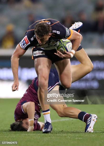 Thomas Banks of the Brumbies is tackled during the Super Rugby AU Grand Final between the Brumbies and the Reds at GIO Stadium on September 19, 2020...