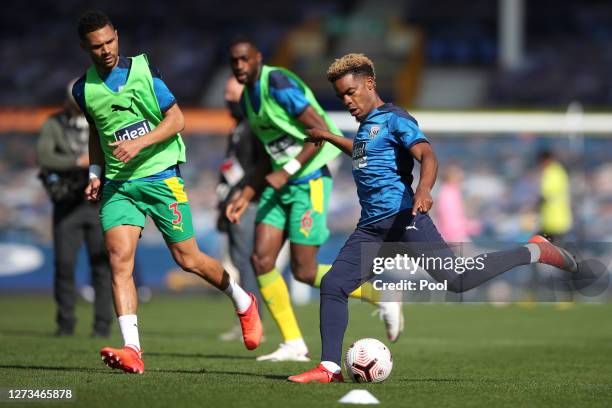 Grady Diangana of West Bromwich Albion and Kieran Gibbs of West Bromwich Albion warm up prior to the Premier League match between Everton and West...