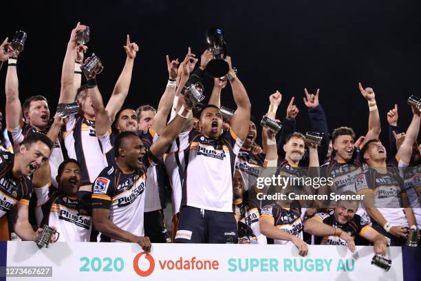 Allan Alaalatoa of the Brumbies holds aloft the Super Rugby AU trophy after winning the Super Rugby AU Grand Final between the Brumbies and the Reds...