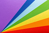 Paper rainbow colored rays stripes background. Pride concept. The basis for a greeting card with copy space.