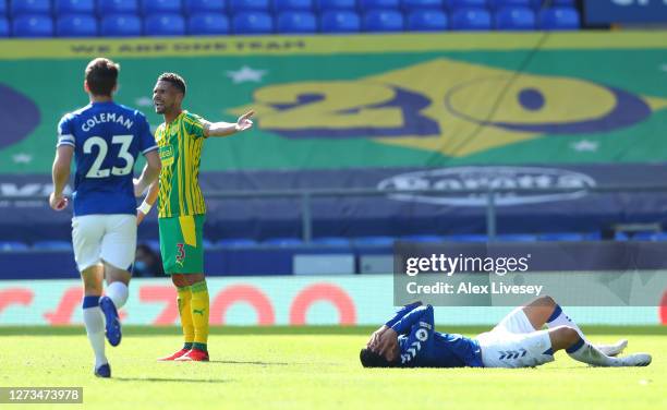 James Rodriguez of Everton holds his face after Kieran Gibbs of West Bromwich Albion challenges him who is later shown the red card during the...